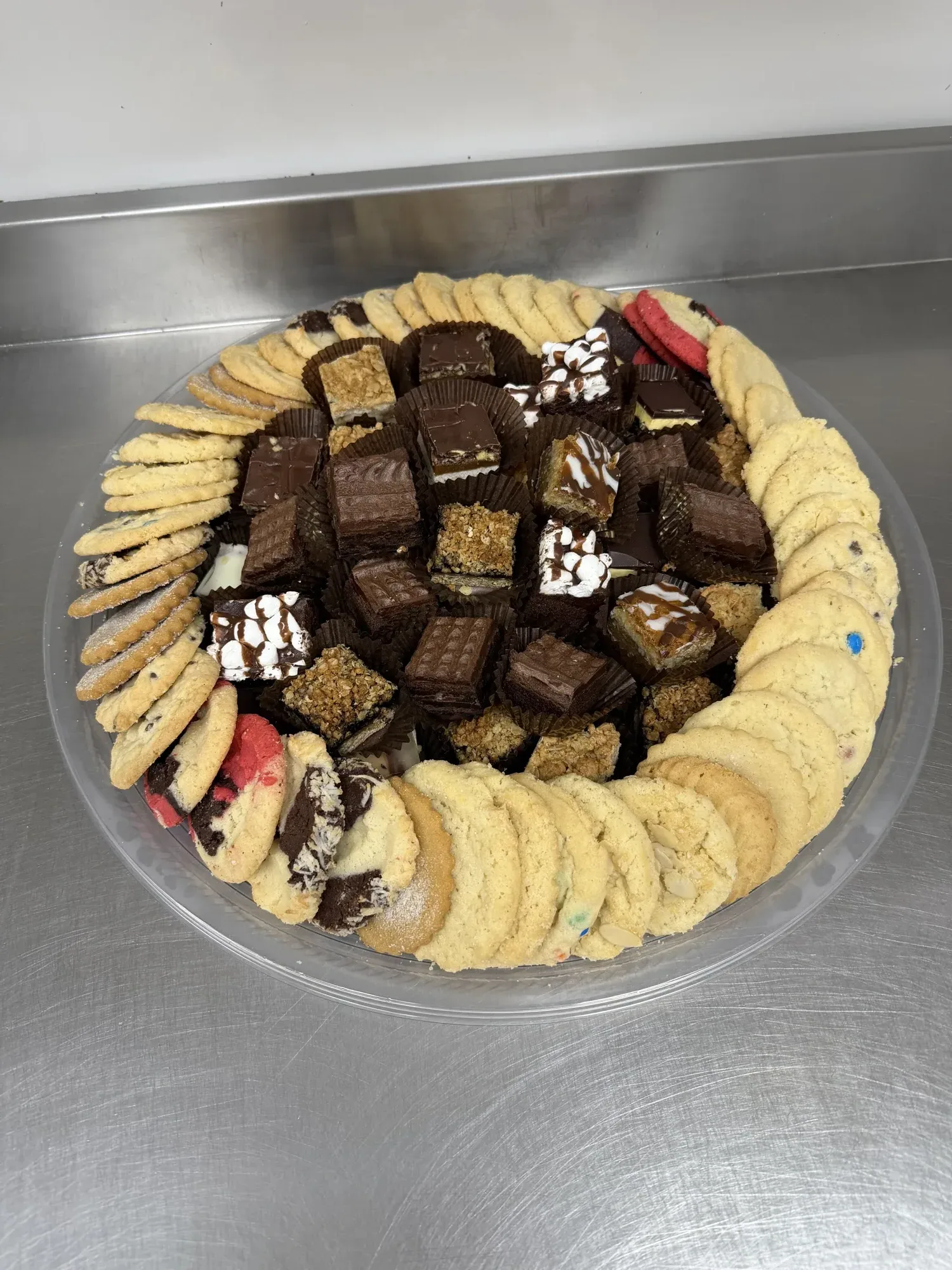 A platter of assorted cookies and chocolate squares