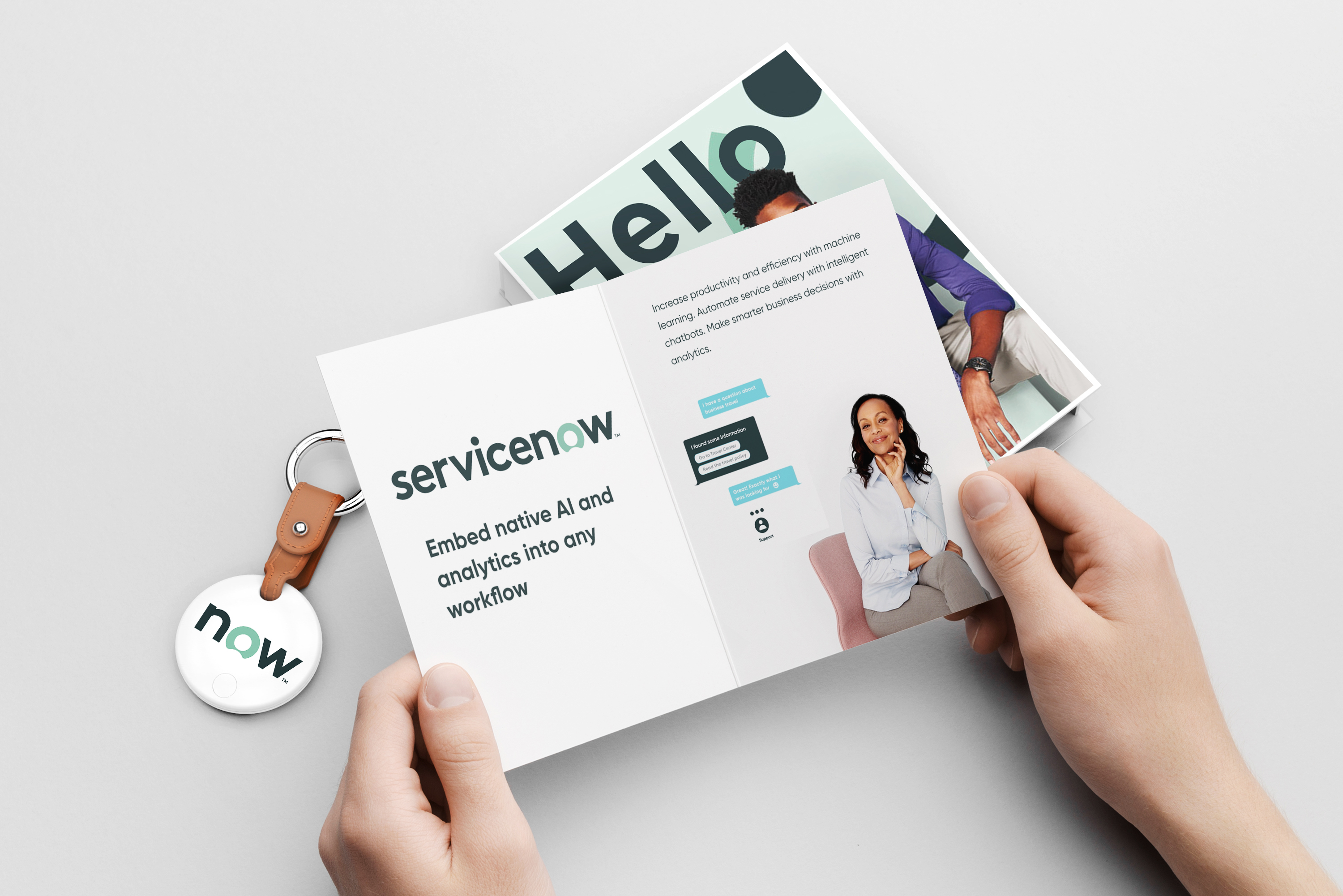 A branded direct mail box open on a desk with a physical product inside and a printed card