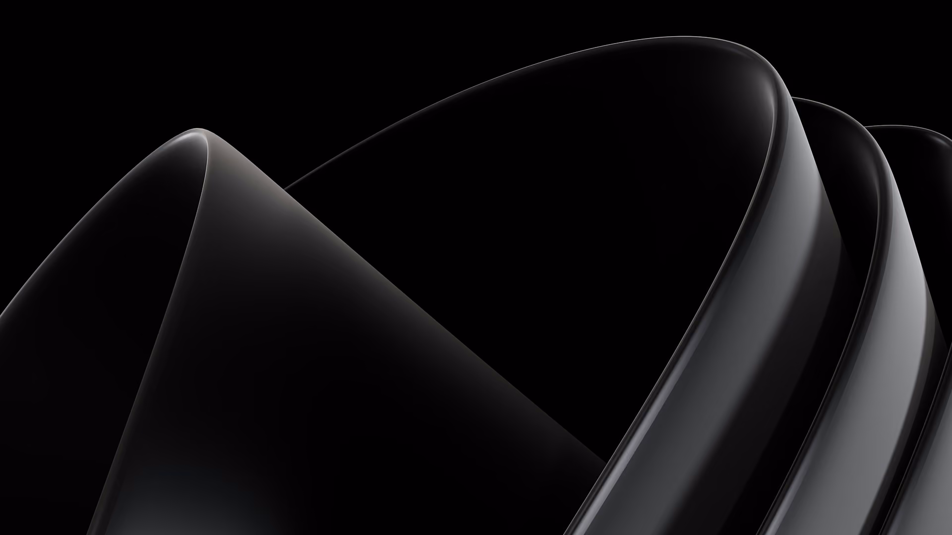 Smooth, flowing black and gray abstract ribbons on a black background.