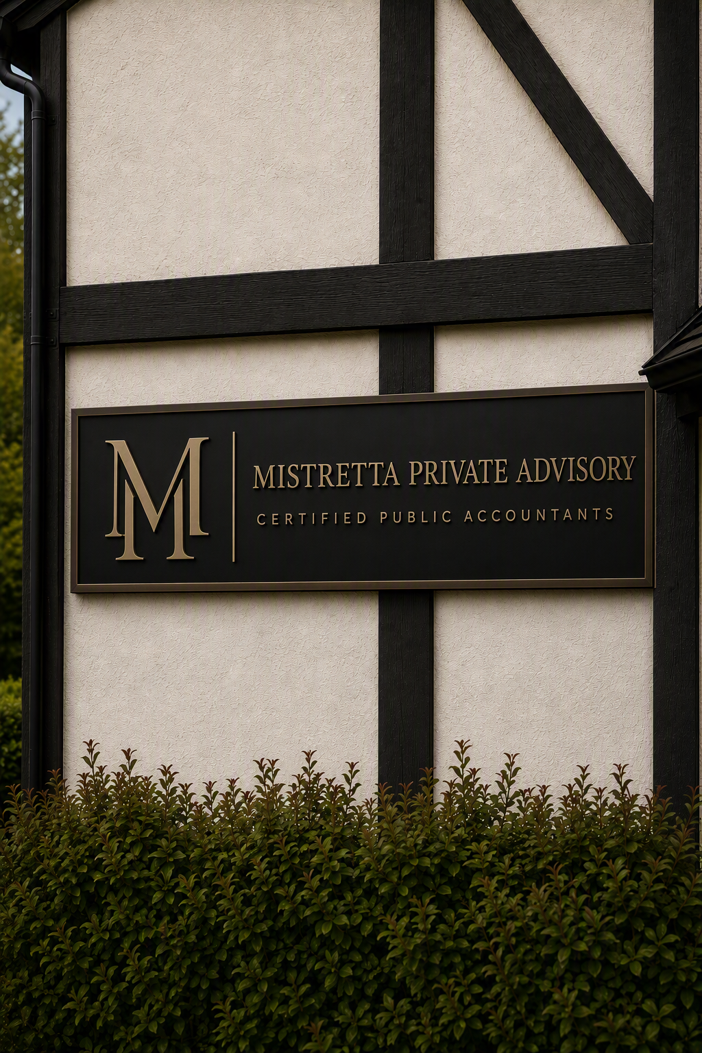 Sign on building wall reads 'Mistretta Private Advisory Certified Public Accountants' with large letter M logo, surrounded by black timber framing and green bushes below.