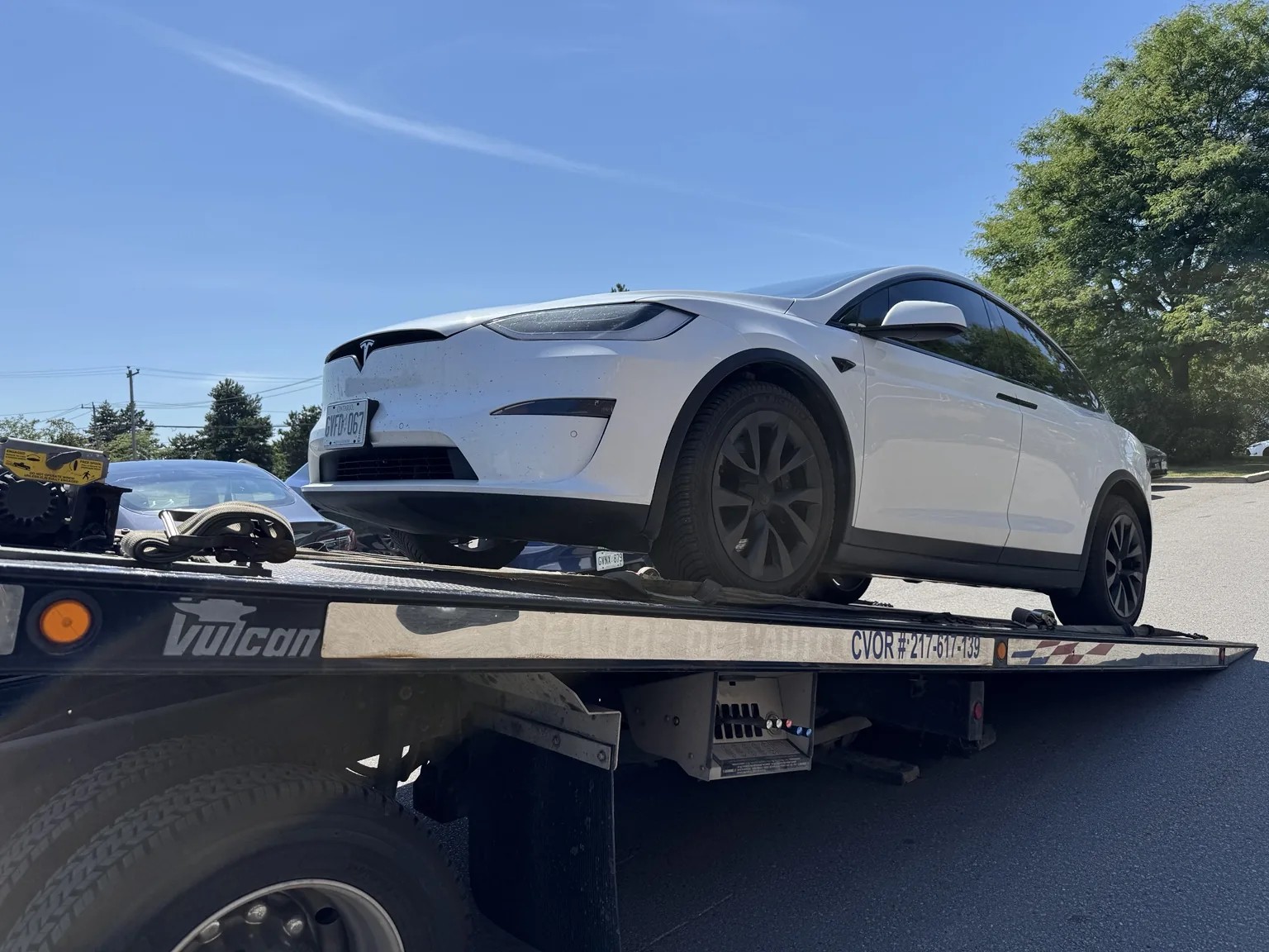 Electric vehicle on Triple S Towing flatbed