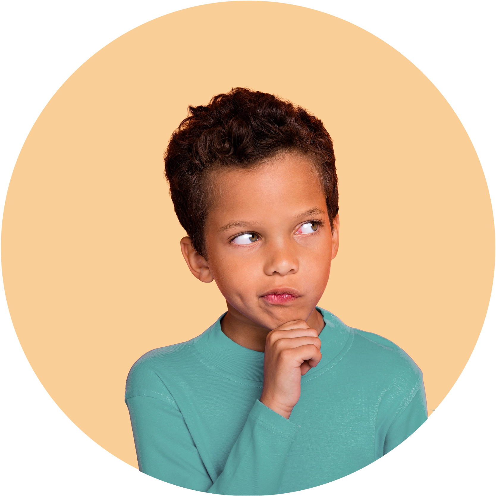 A boy resting his chin on his hand, looking thoughtful