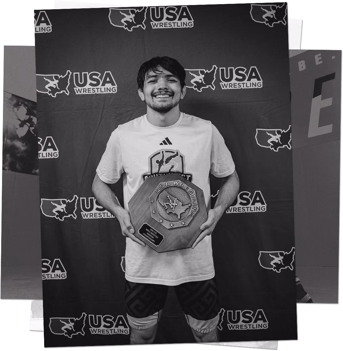 Southwest Wrestling Club athlete holding a championship award at a USA Wrestling event