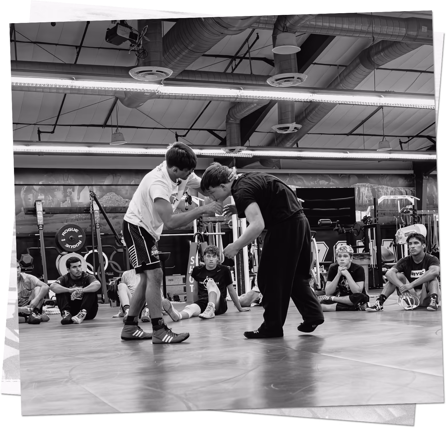 Wrestlers demonstrating technique during a Southwest Wrestling Club training sessio