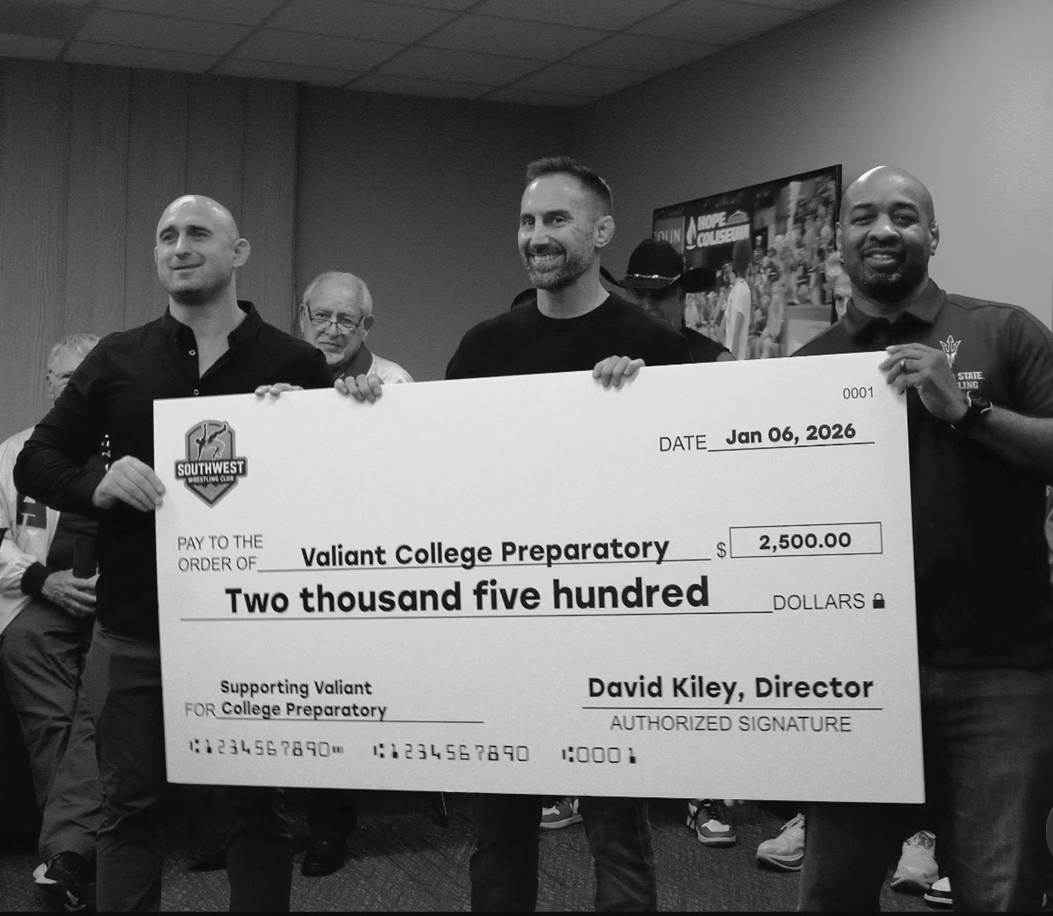 Southwest Wrestling Club presenting a donation to Valiant College Preparatory