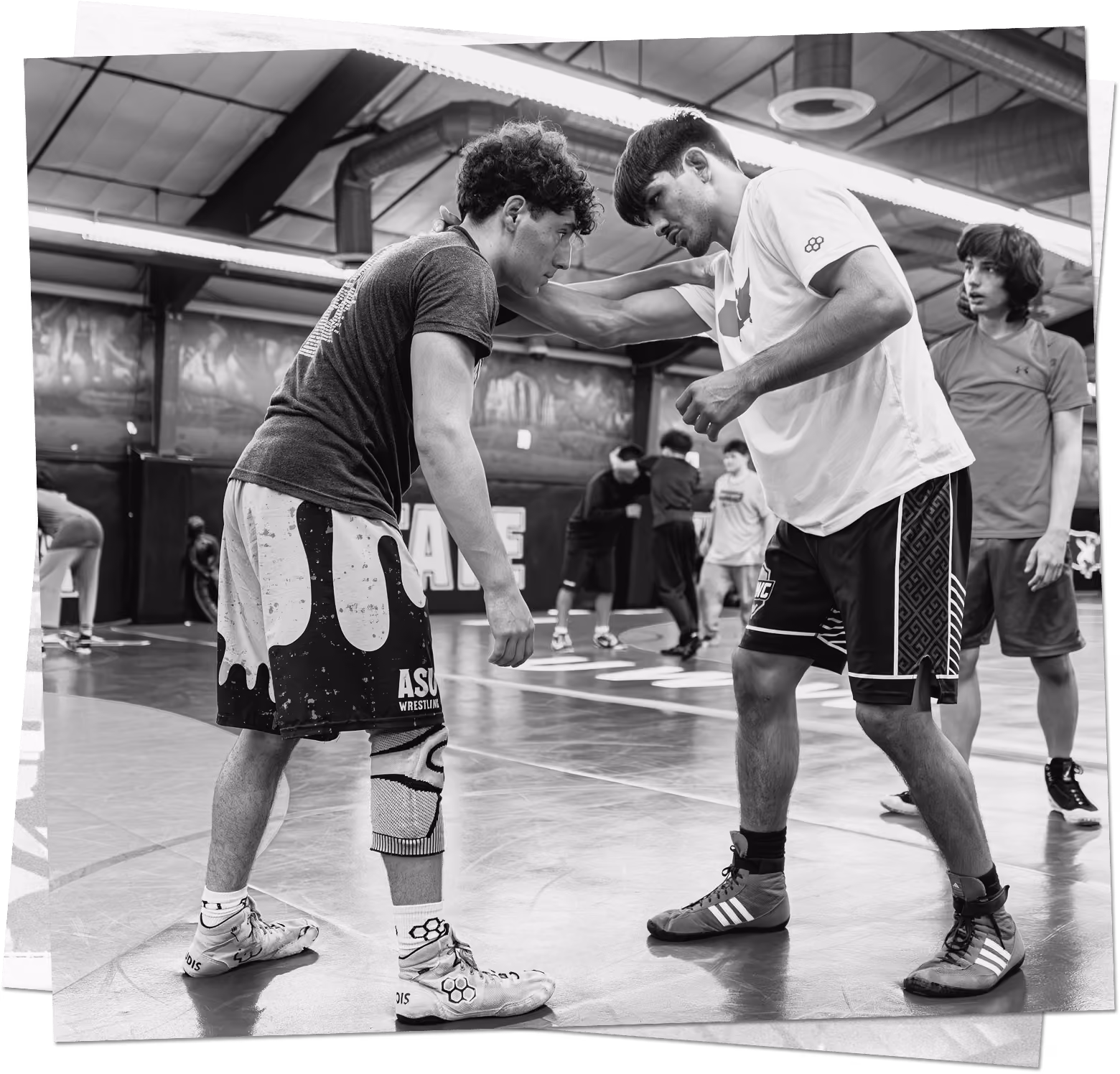 Southwest Wrestling Club wrestler helping a teammate during a training session