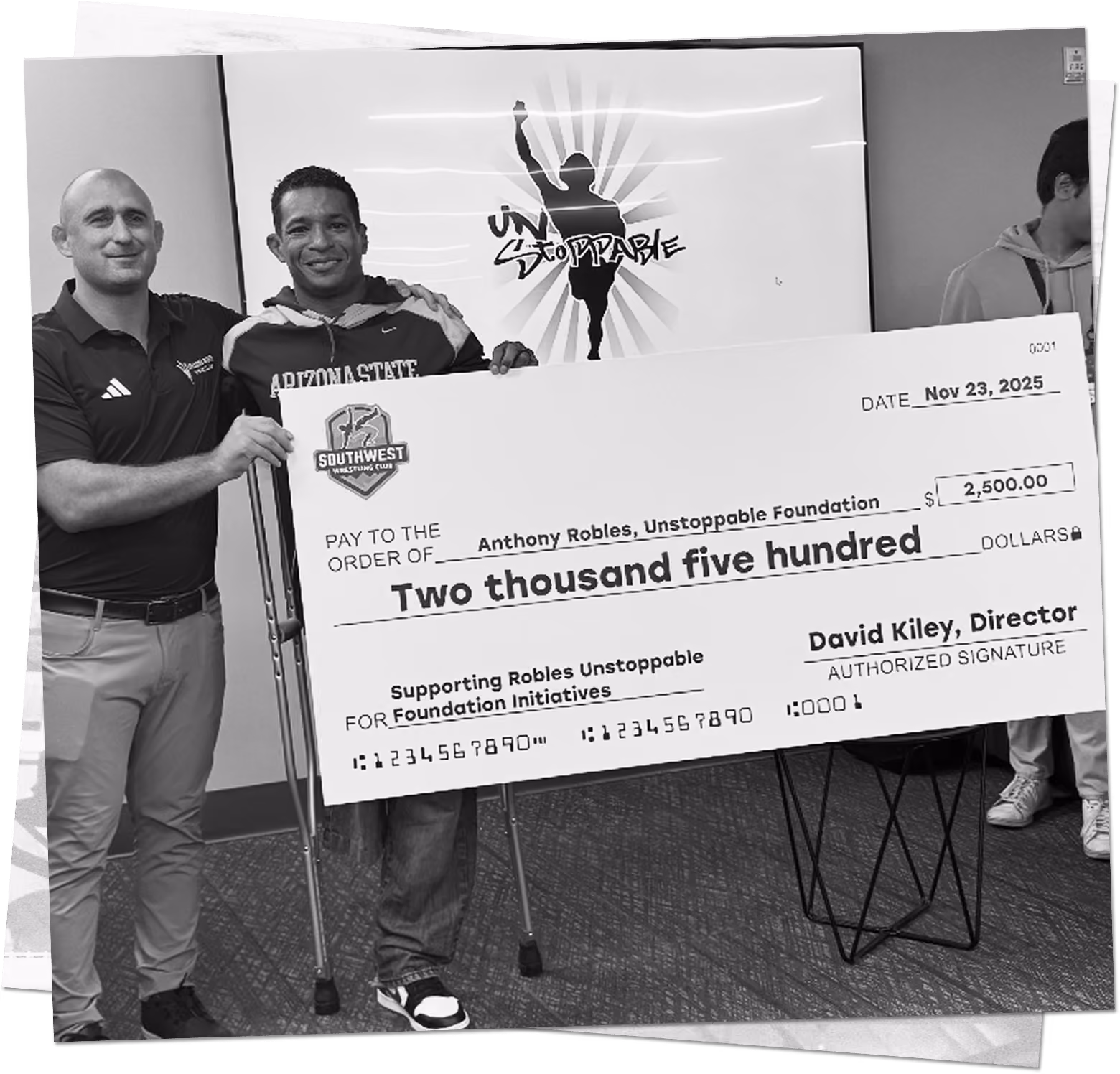 Southwest Wrestling Club presenting a donation to the Anthony Robles Unstoppable Foundation