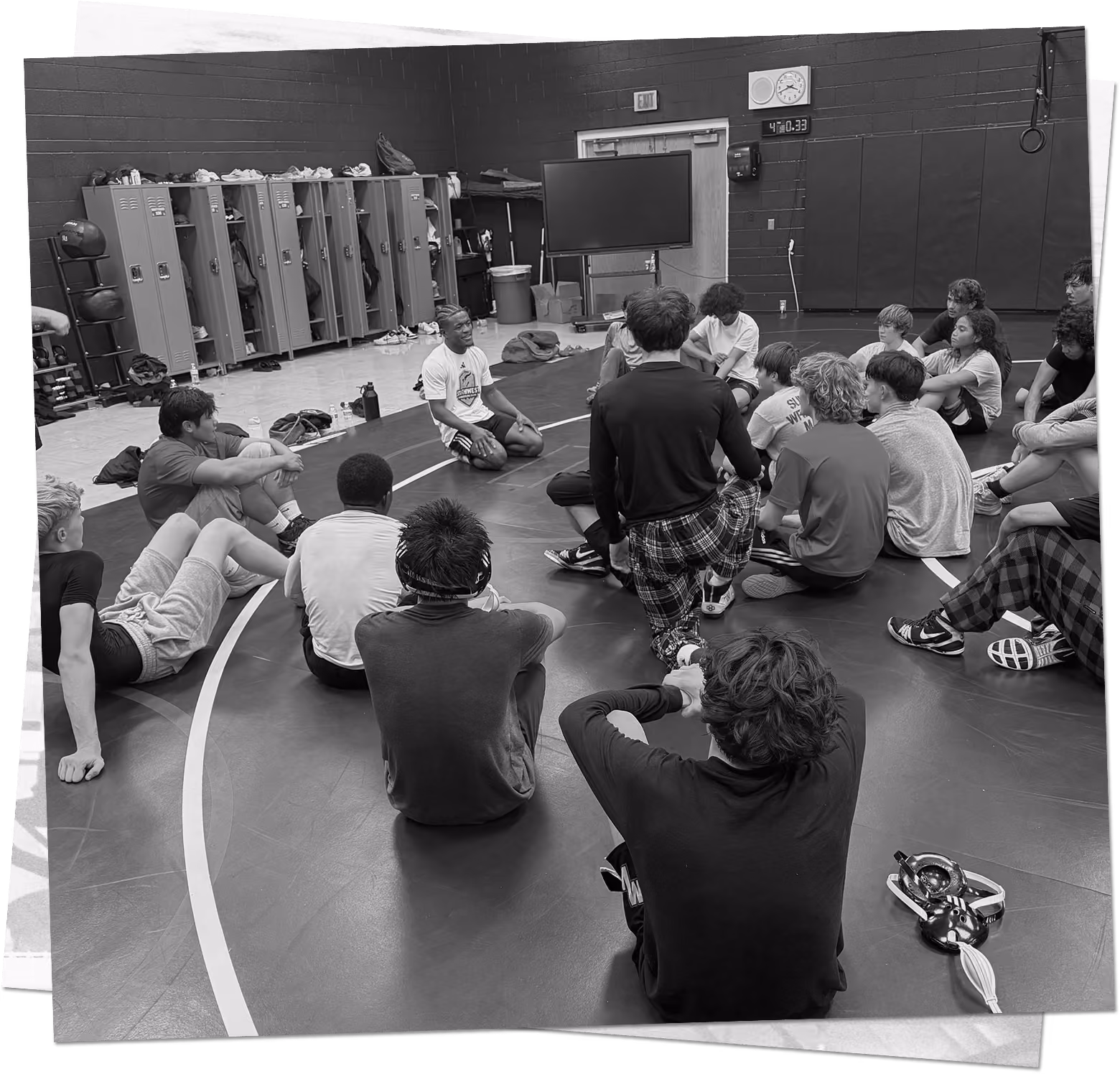 Wrestlers attending a group instruction session at a Southwest Wrestling Club camp