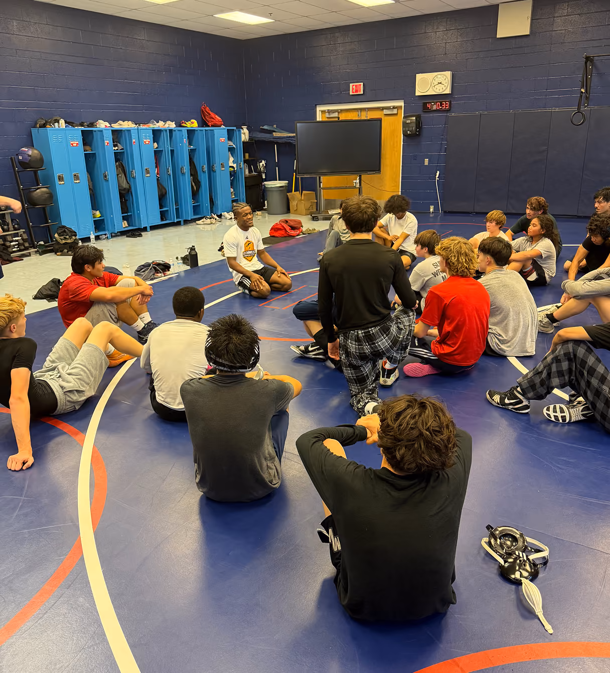 Wrestlers attending a group instruction session at Southwest Wrestling Club