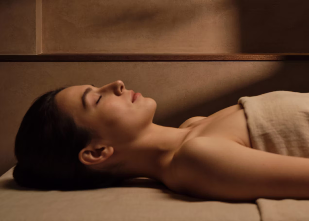 Serene woman enjoying a music moment indoors