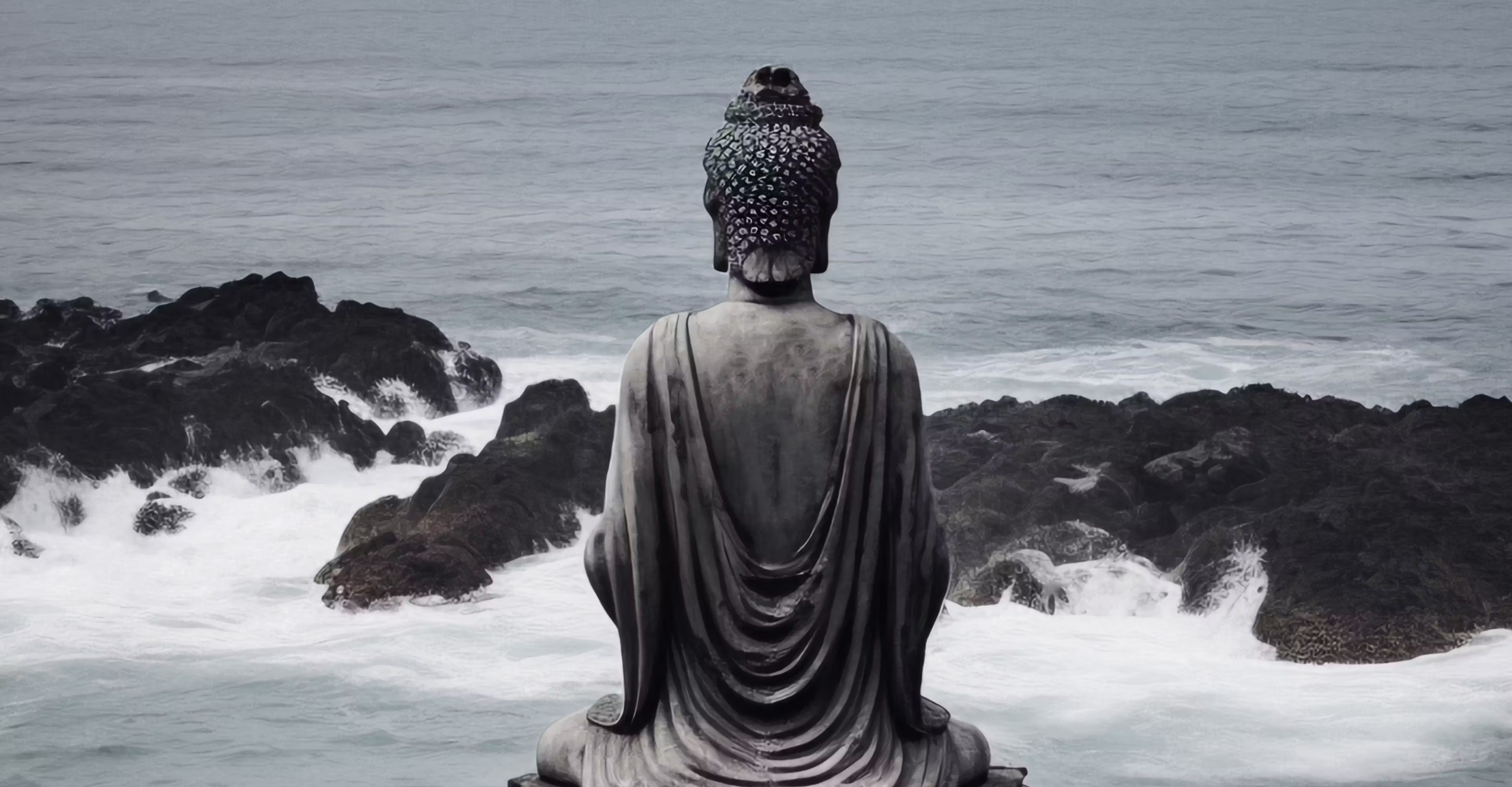 Woman doing yoga on the beach at sunset