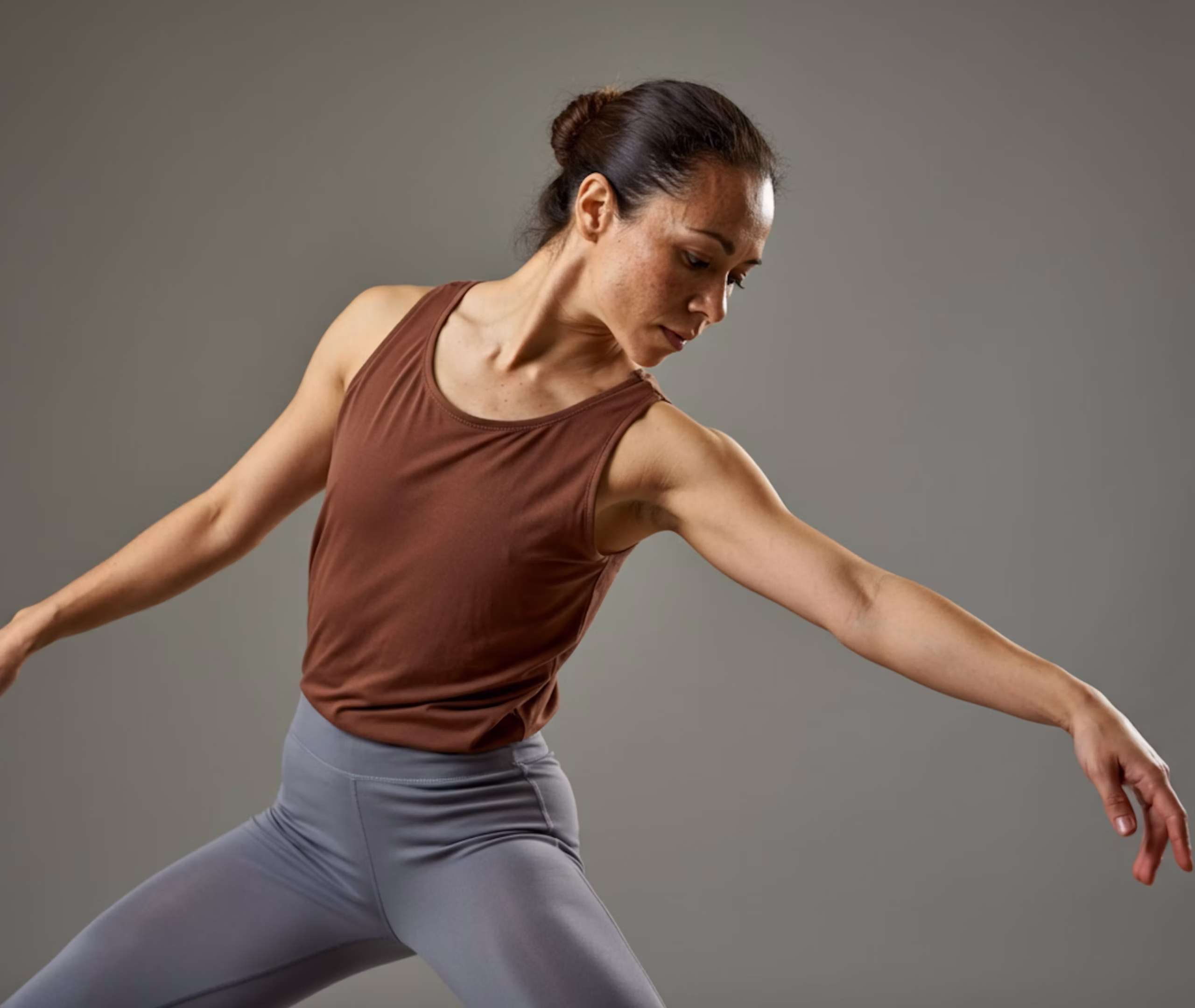 Close-up of a woman's legs in a yoga pose wearing leggings