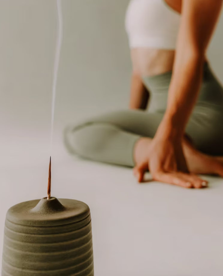 Therapist giving a back massage during a herbal apothecary treatment