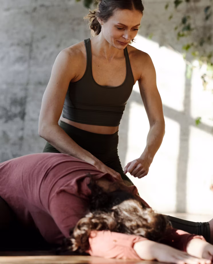 Therapist giving a back massage during a herbal apothecary treatment