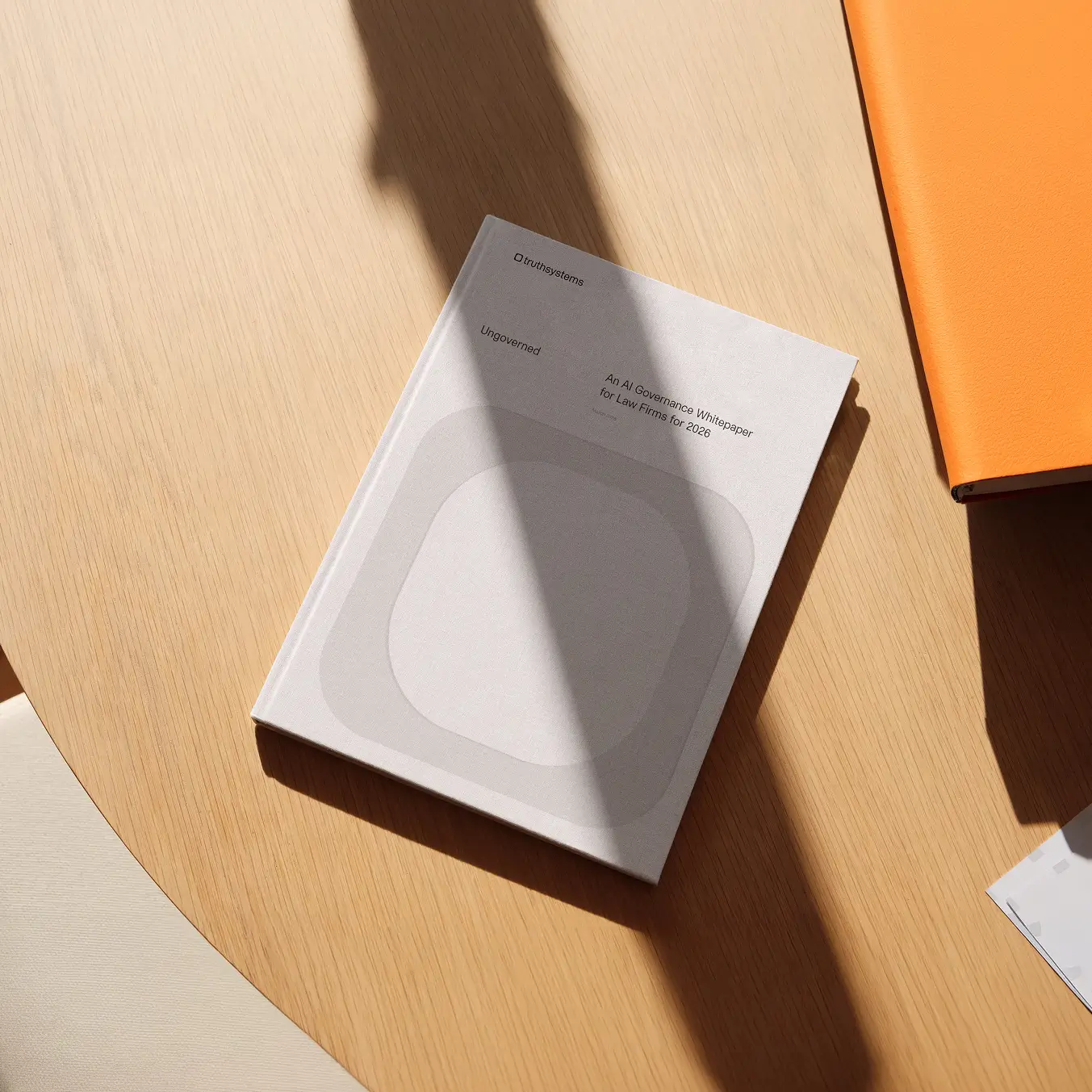 The Harvey white paper printed book lies on a table.