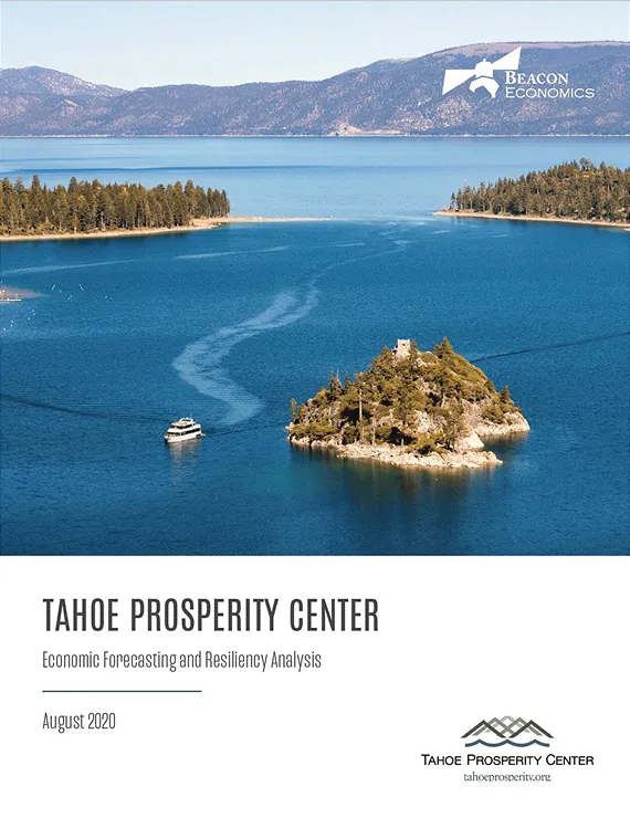 Lake with a boat near a small tree-covered island and mountains, cover of Tahoe Prosperity Center report.