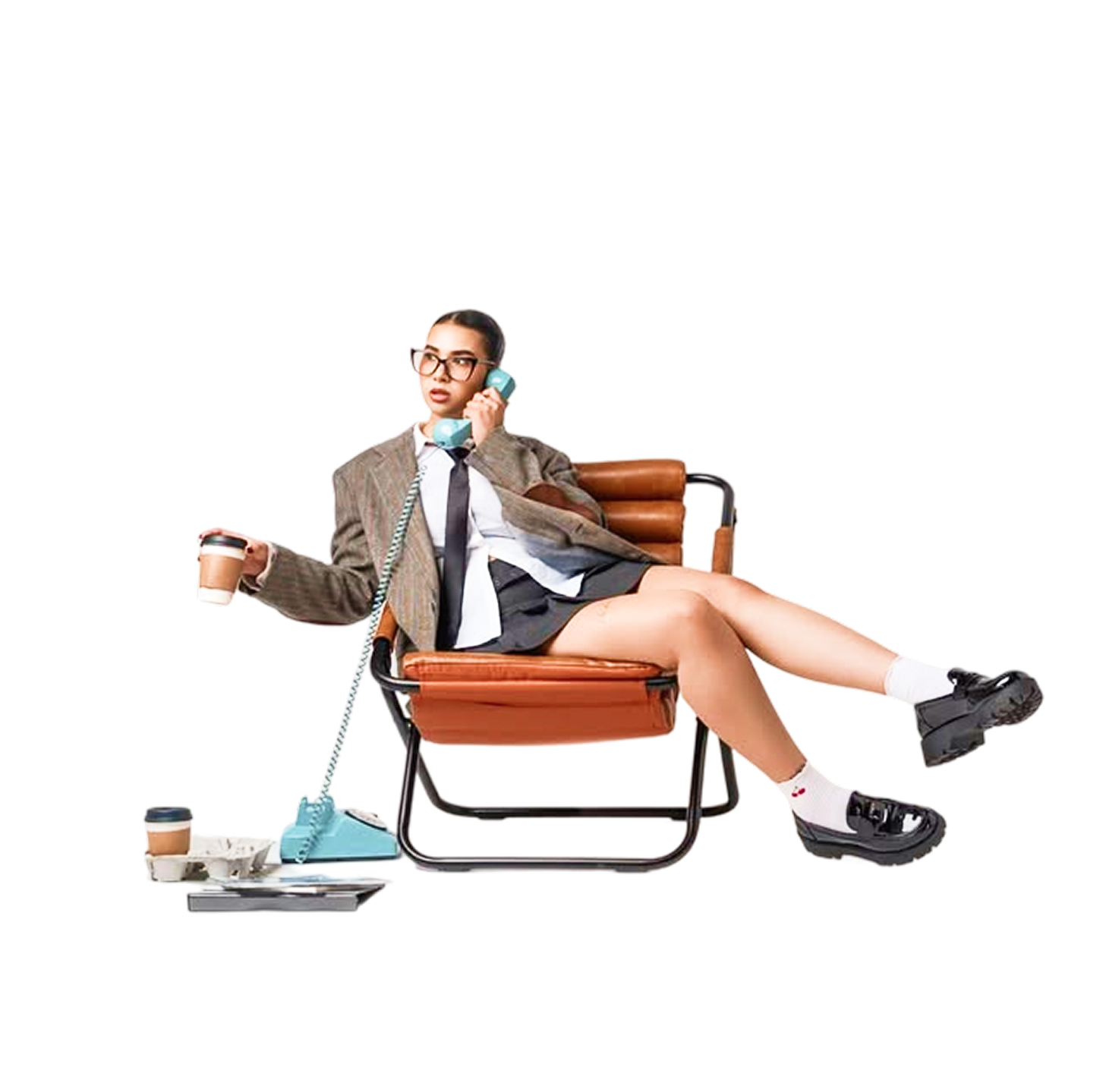 Woman in a lounge chair talking on a retro telephone