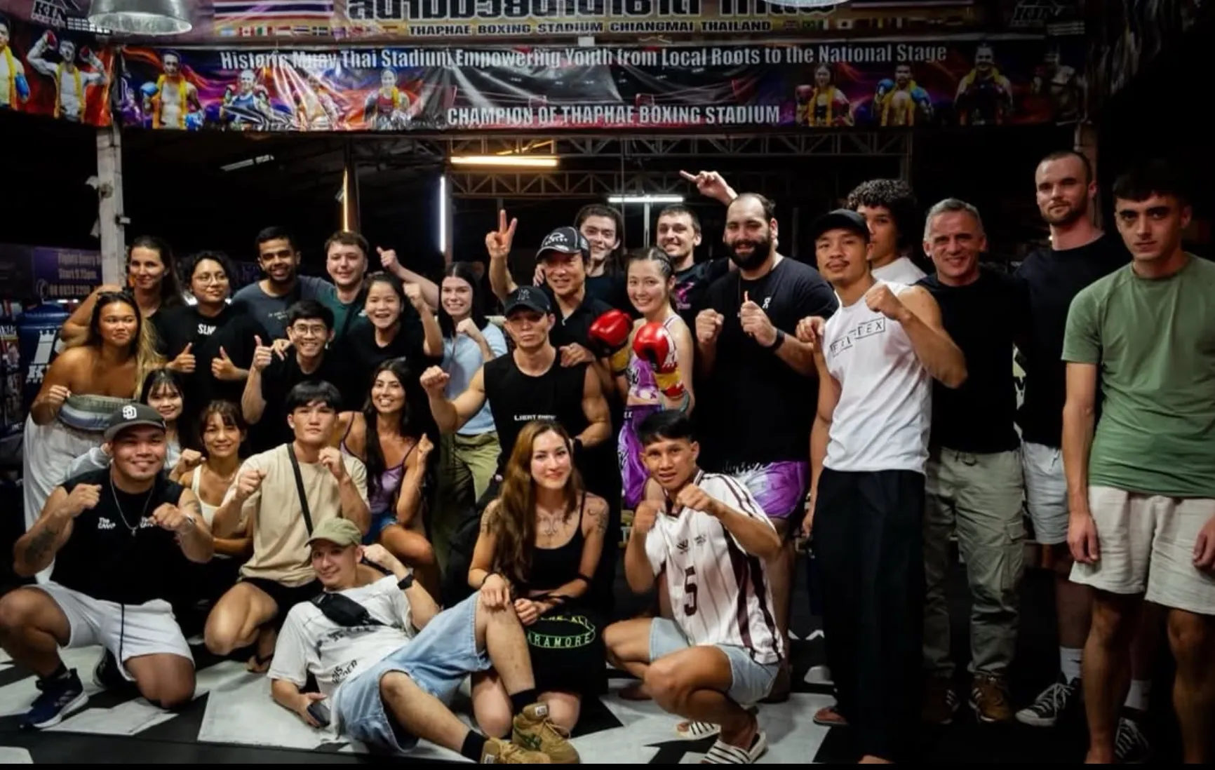 The Camp community gathered together at a Muay Thai stadium