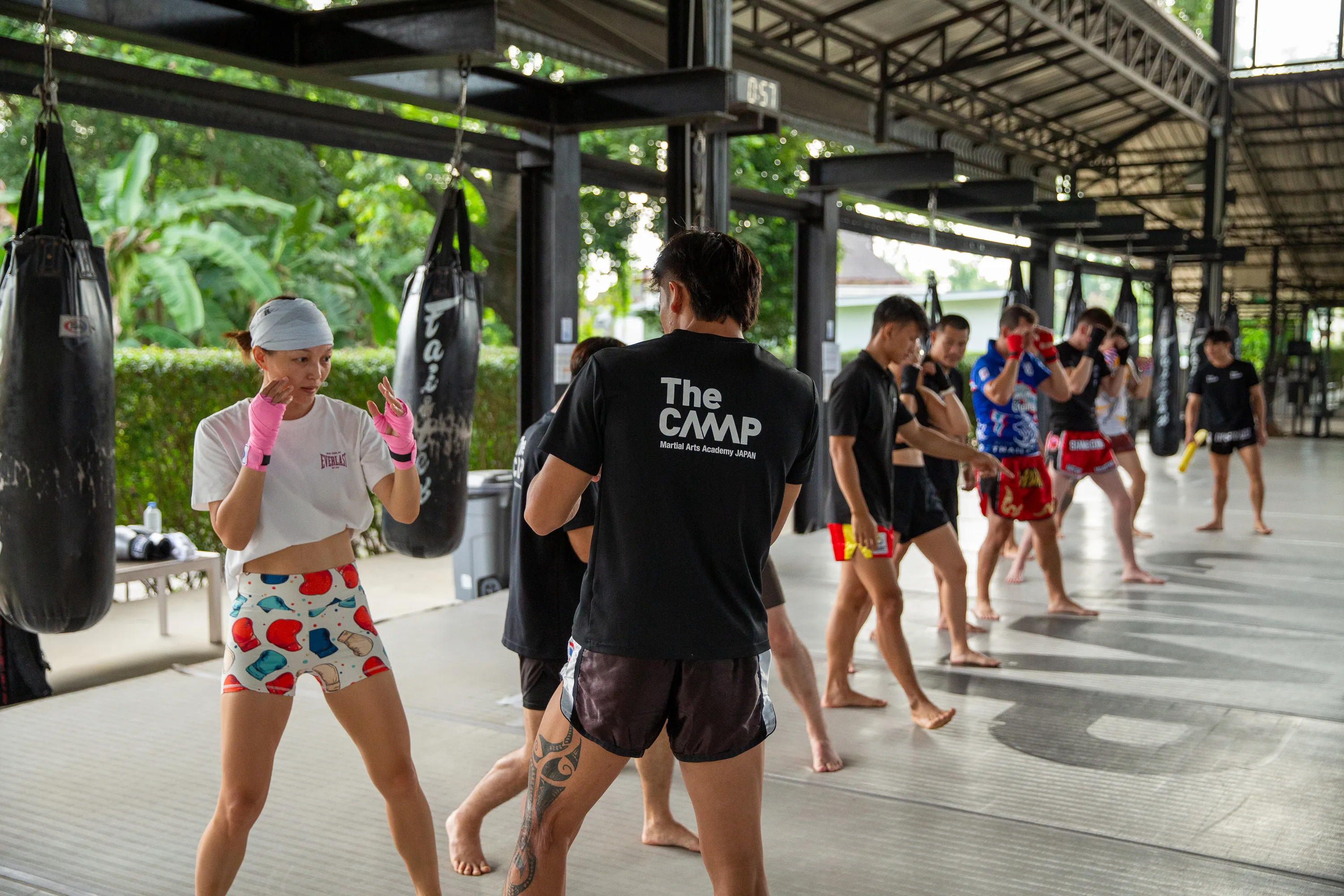 A student practising with her Muay Thai coach