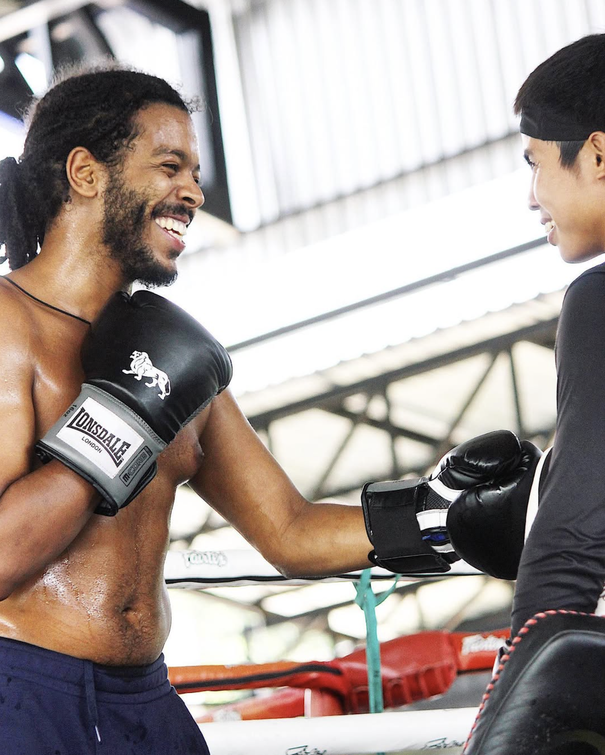 A student and trainer smiling during training