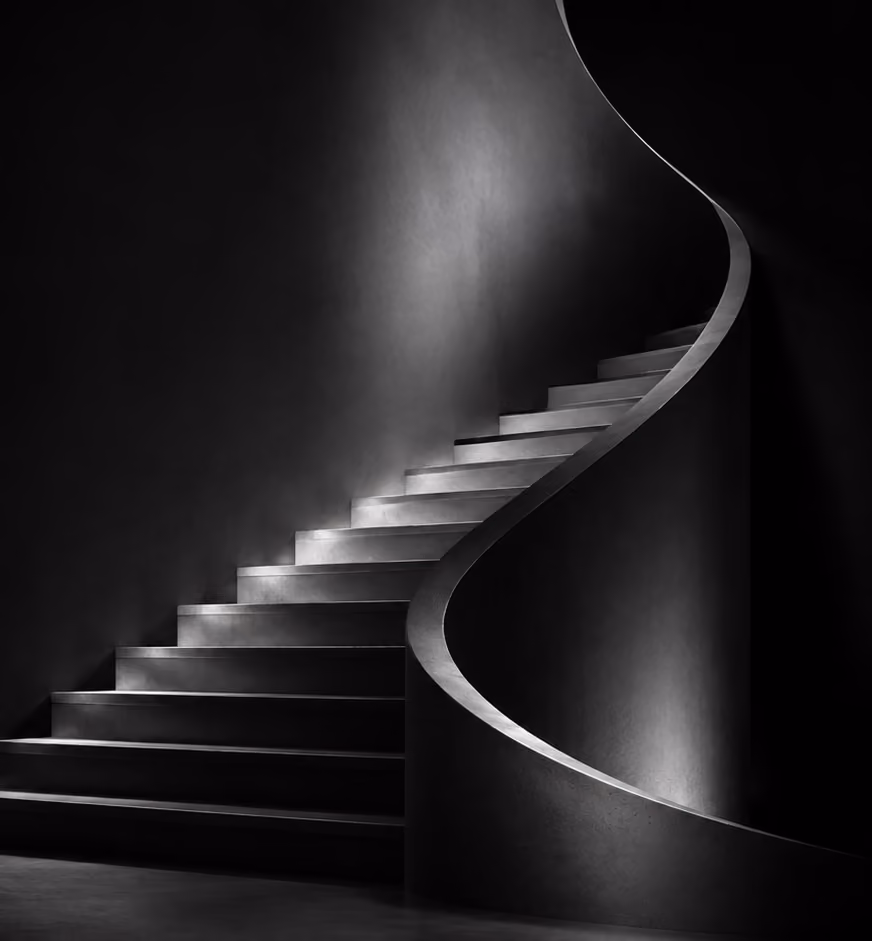 Curved staircase with seamless plaster finish by Arden Strata