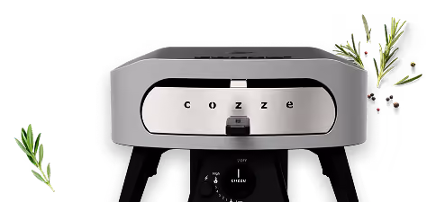 Grå Cozze pejs på sorte ben med krydderurter ved siden af.
