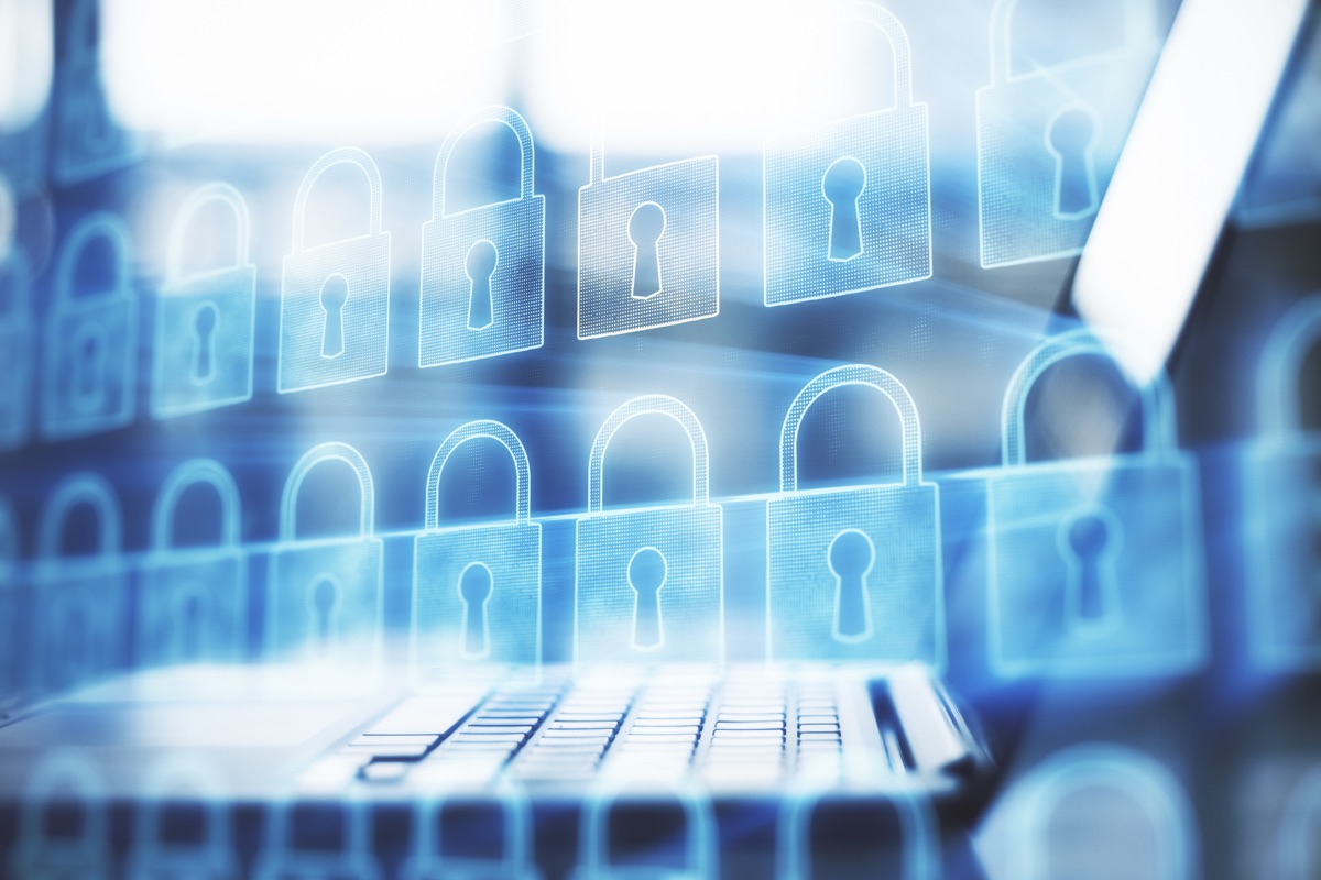 Laptop and phone representing synced passkey authentication