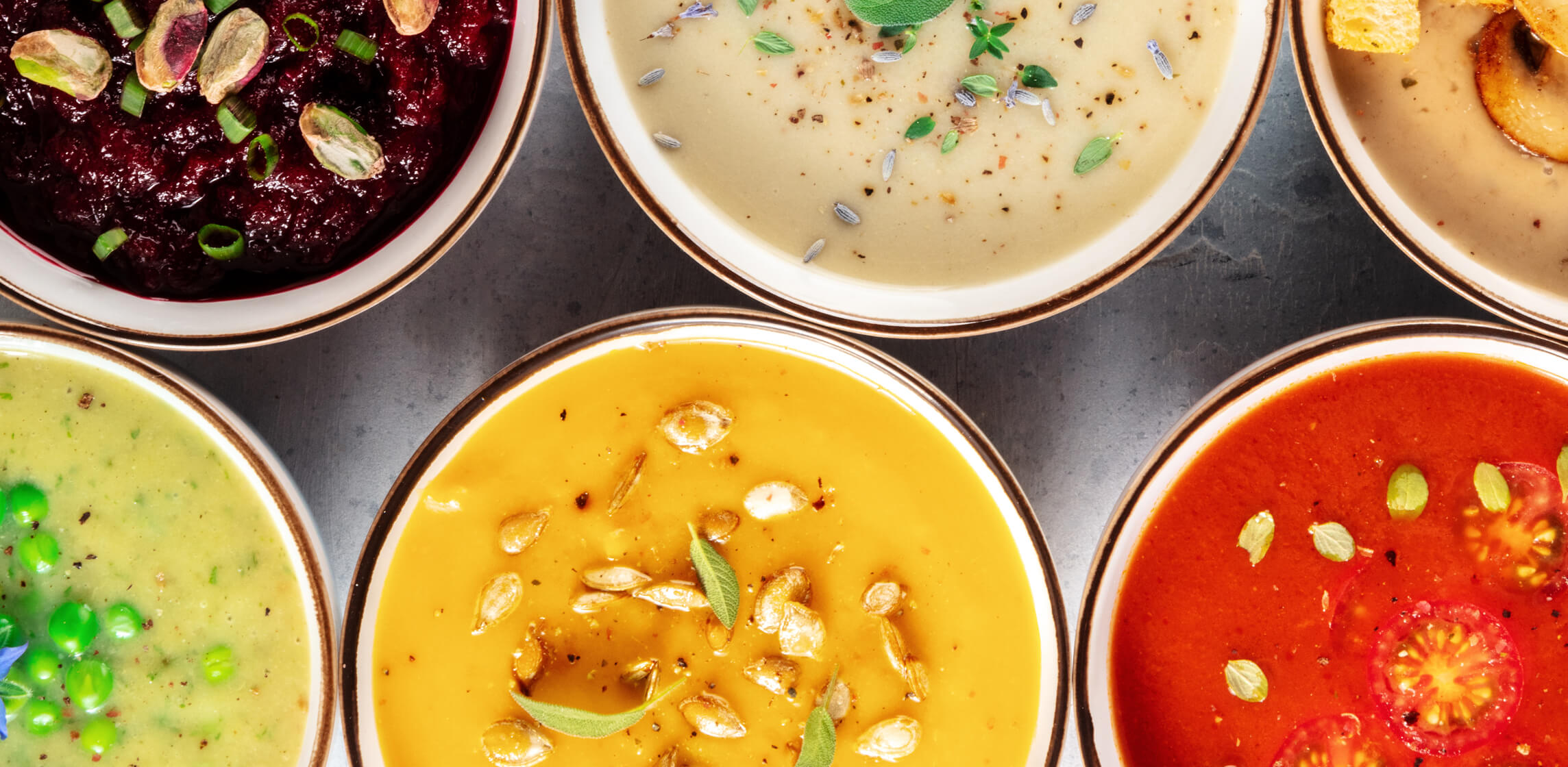 Bowls of classic comfort soup with fresh tomatoes and herbs, featured in WISEcode's canned soup ingredient quality review