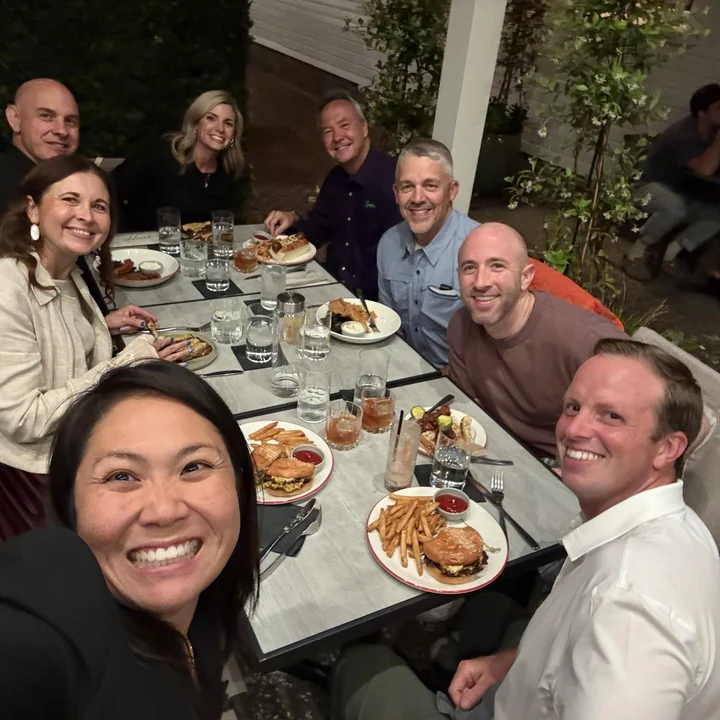 Community members around a dinner table