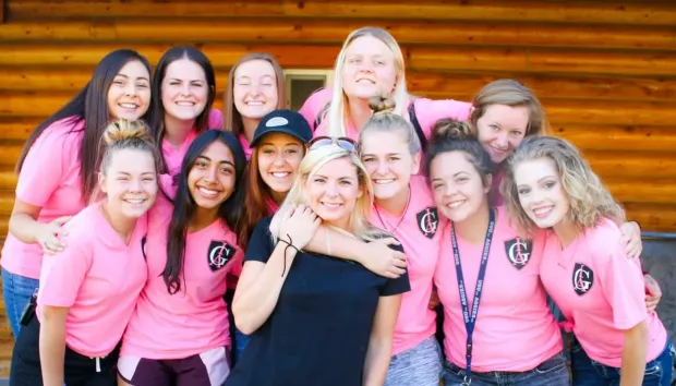 Missy Moss Wright with a group of young women after a talk