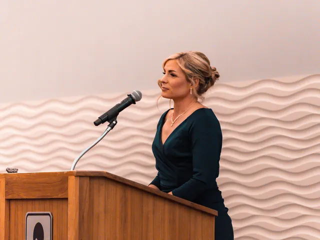 Missy Moss Wright speaking at a podium