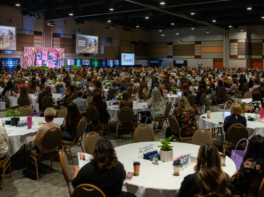 A ballroom filled with women at round tables during Missy Moss Wright's keynote