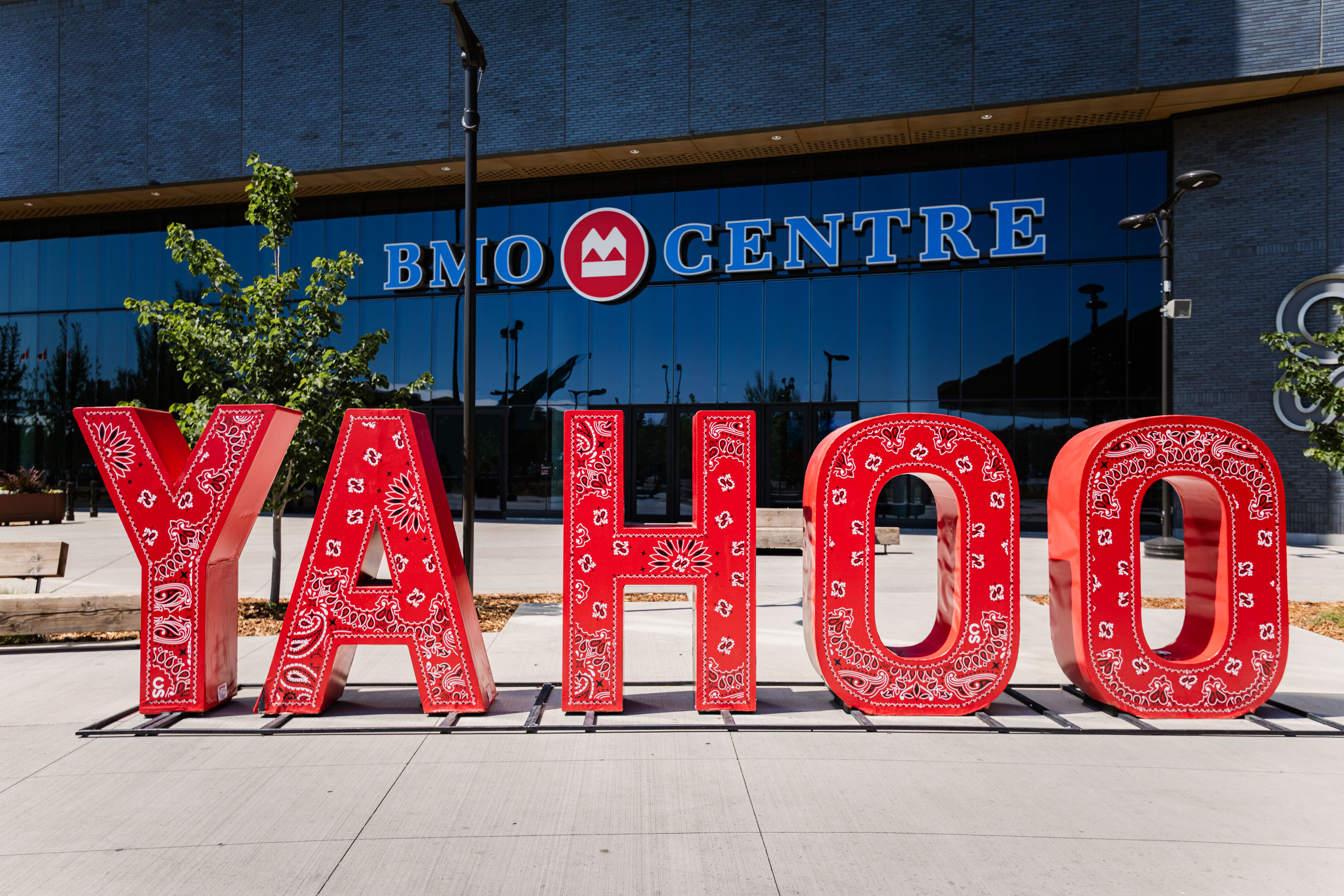 Large red letters spelling YAHOO decorated with white paisley patterns outside BMO Centre.