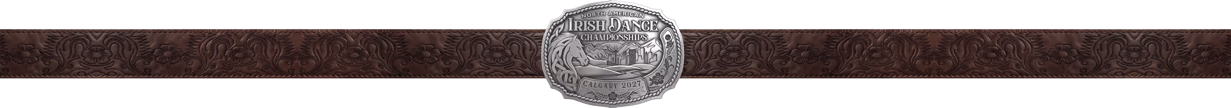 Intricately designed metal belt buckle with Irish dance themed engravings and decorative border on a brown patterned leather belt.