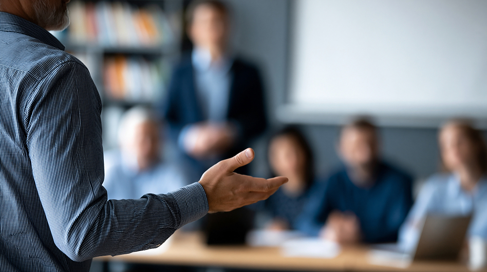 Sales leaders in a coaching session