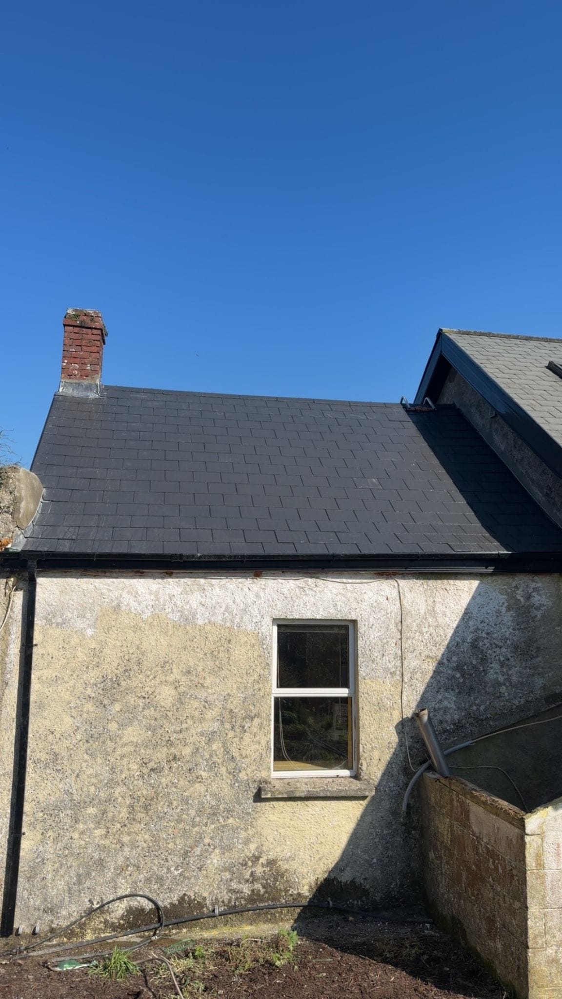 Clean roof and gutter line on a recently completed Overhaul Roofing project
