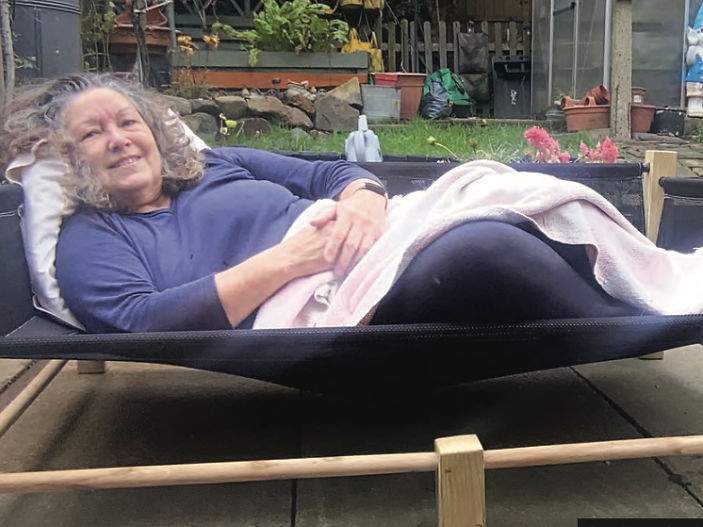 The lady sleeping out all night in a dog bed for Street Paws Charity