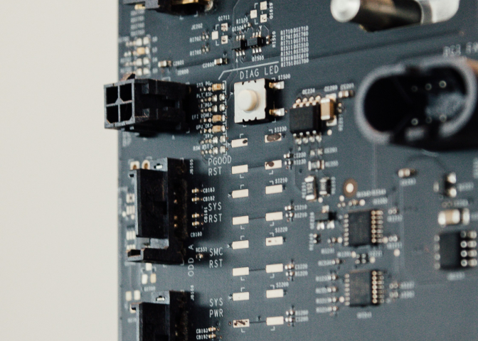 Close-up of a circuit board with connectors, labeled LEDs, and various electronic components.