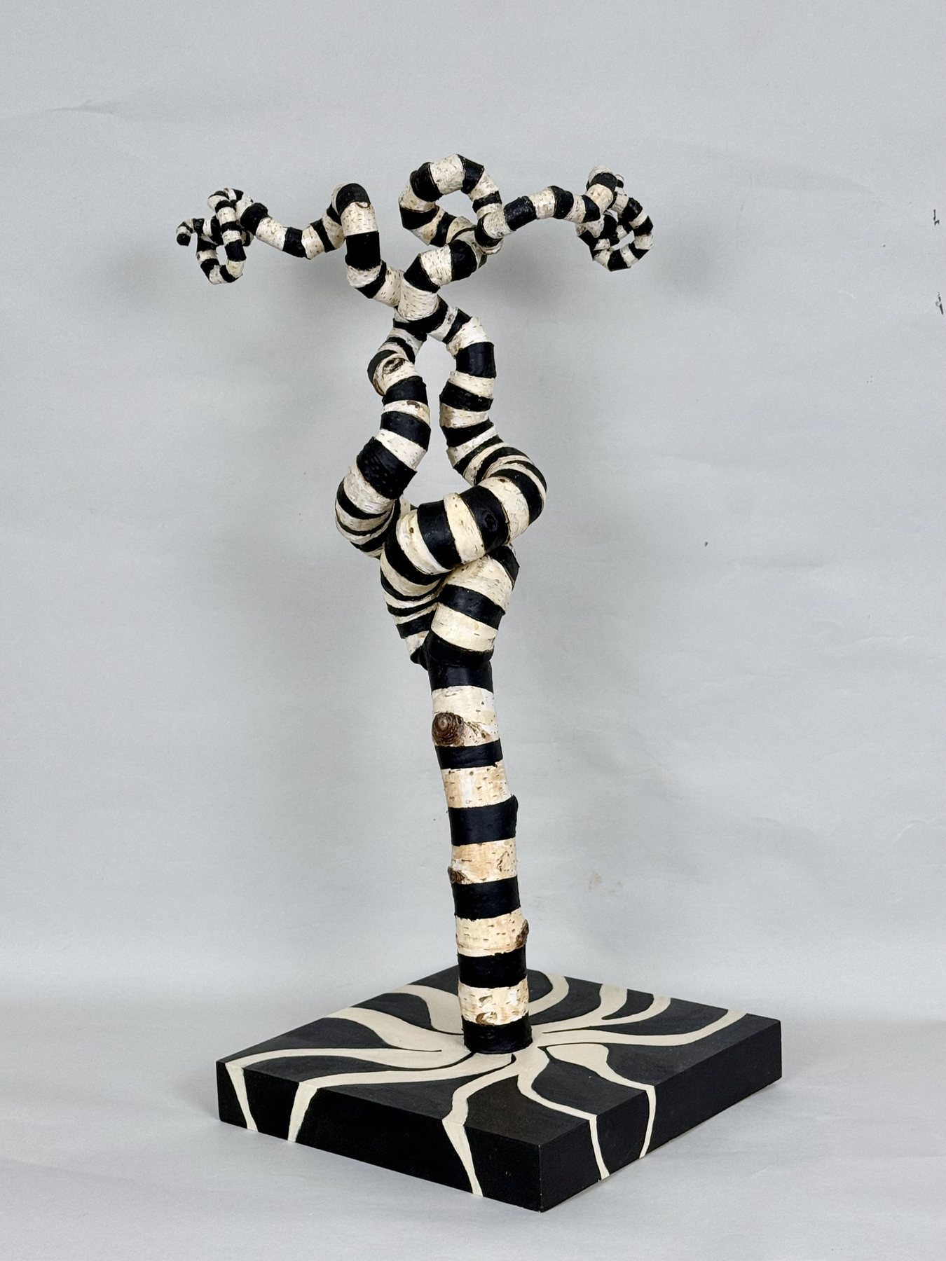 Jester, a slender painted figure