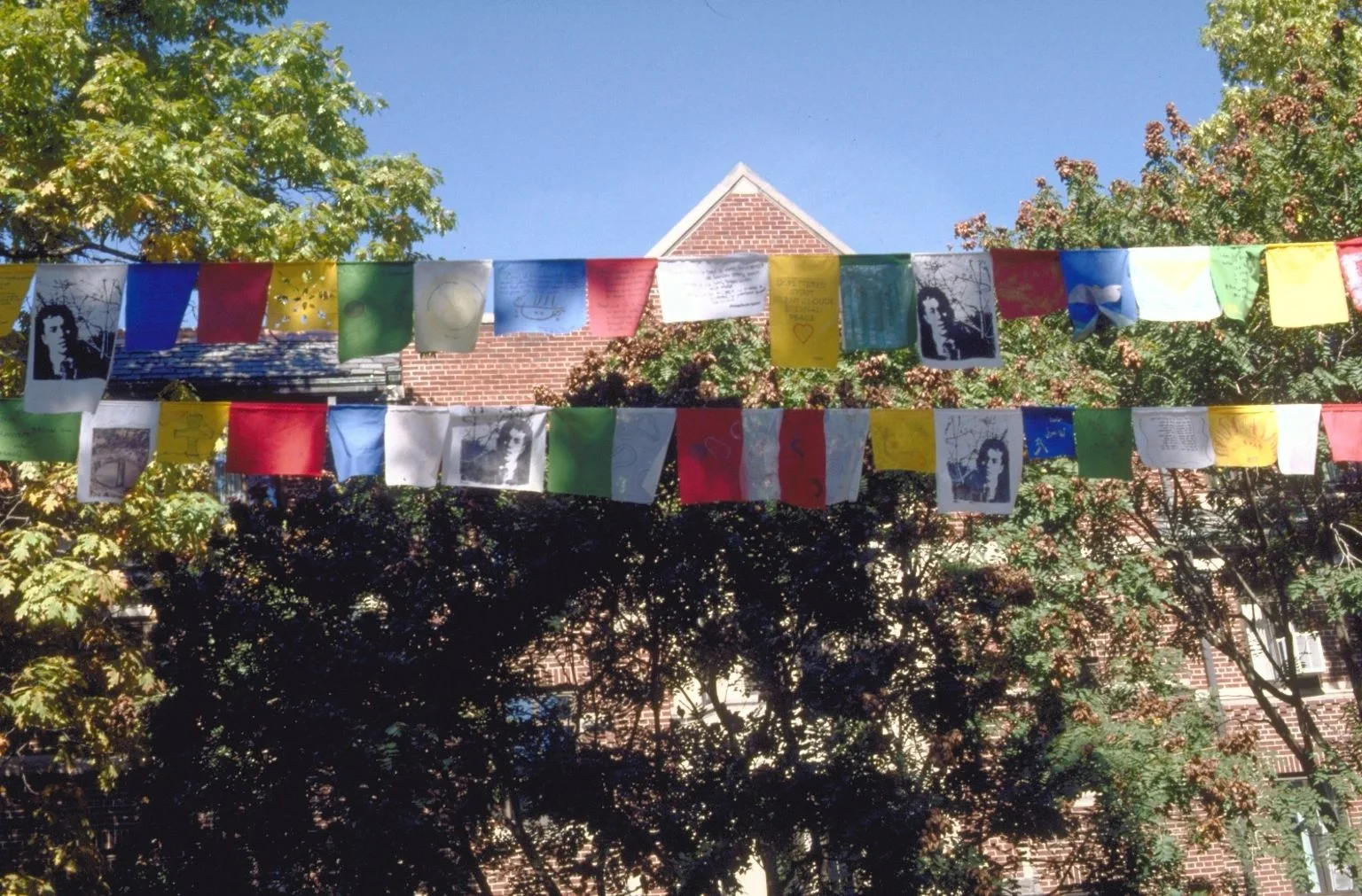 Prayer flags strung across the gallery