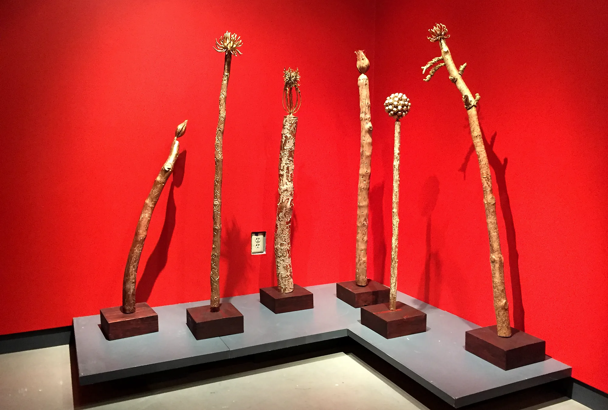 The totems on the red wall
