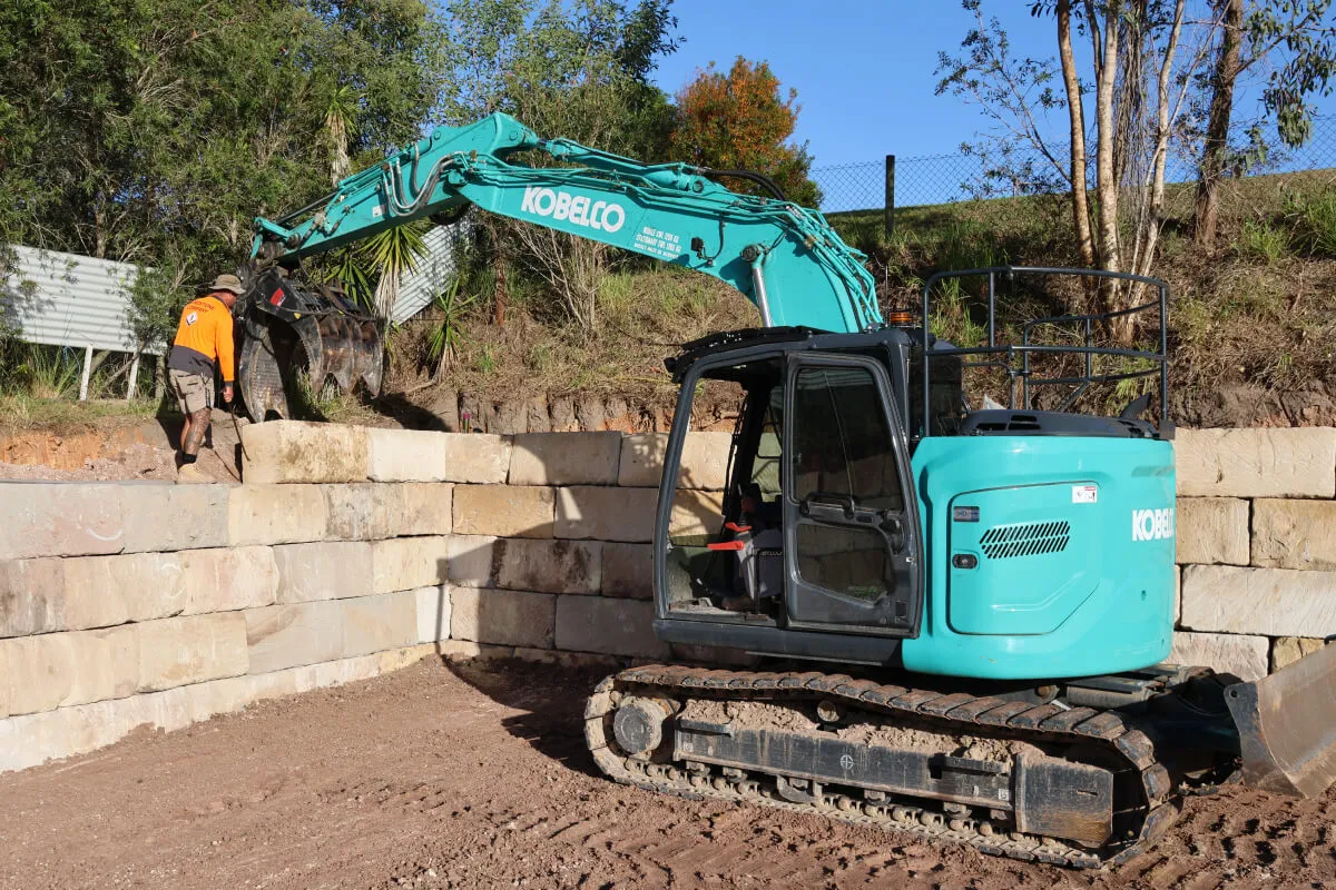 Bulk Earthworks service in Brisbane. Pad cutting & grading using excavators.