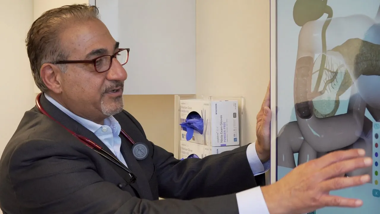Sia Sobhani, MD explaining a scan in the exam room