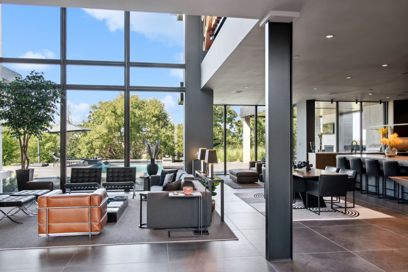 Double-height resident lounge with seating and planting
