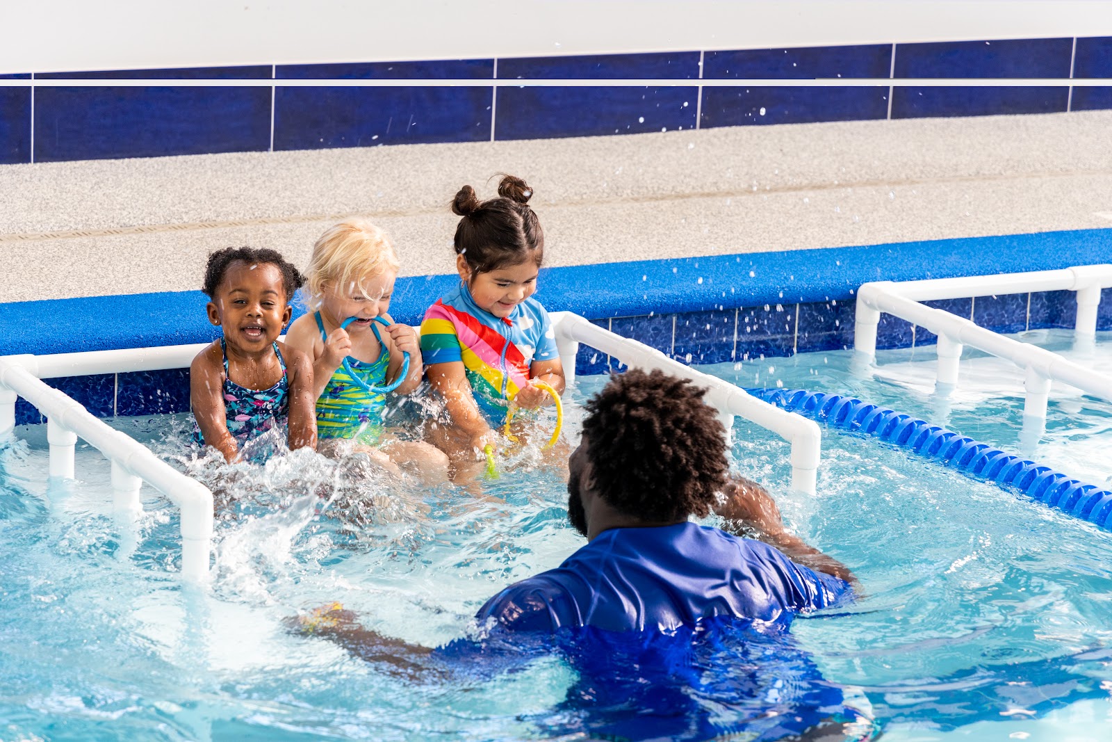 Child learning to swim at SafeSplash Swim School