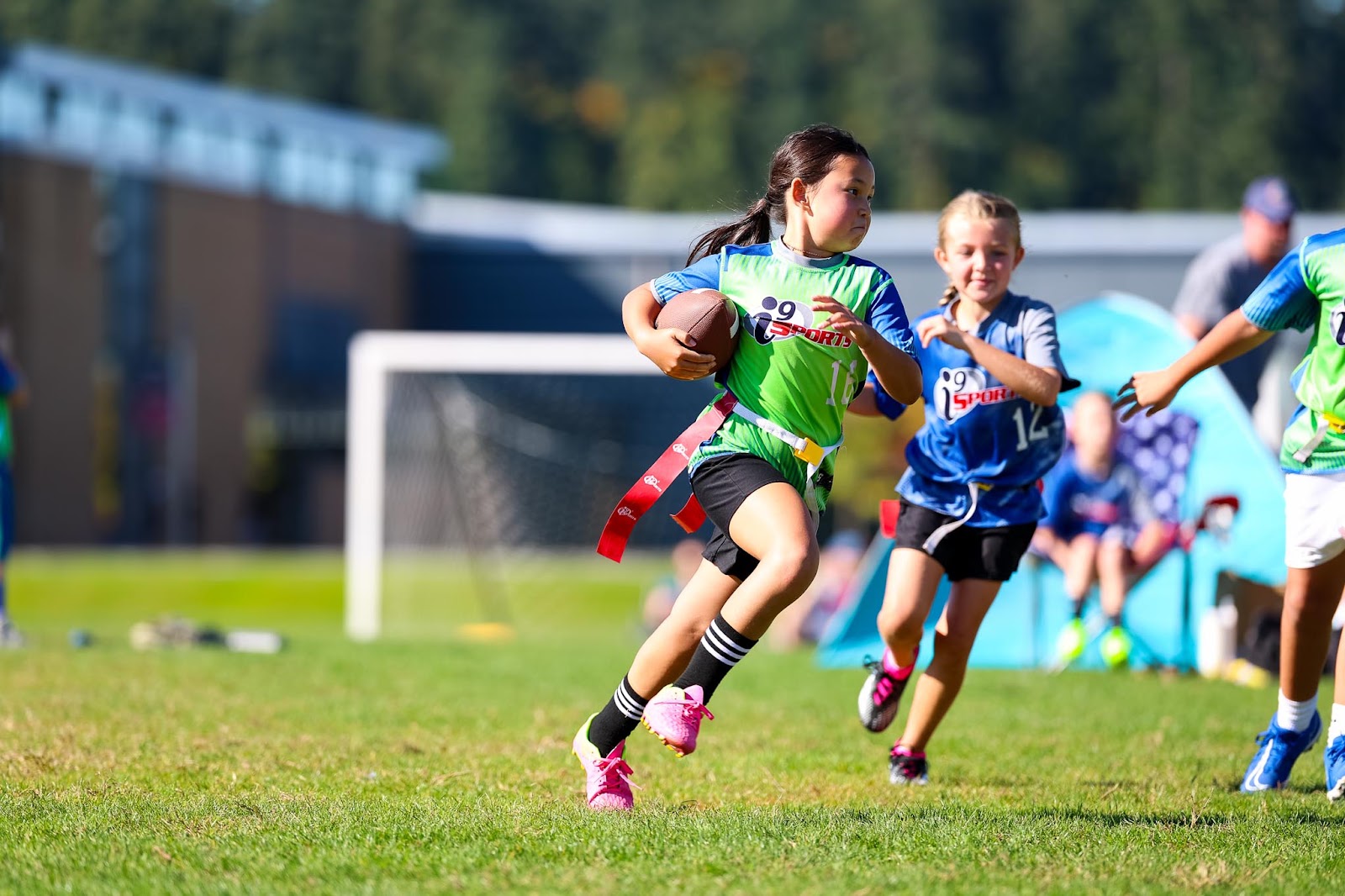 Kids playing in an i9 Sports youth league game