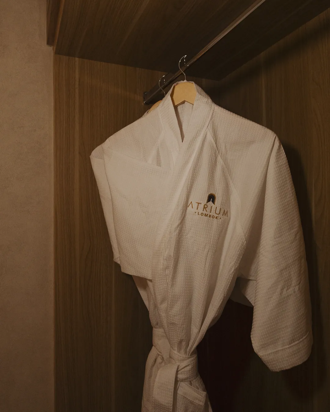 Atrium Lombok bathrobe hanging in a suite wardrobe