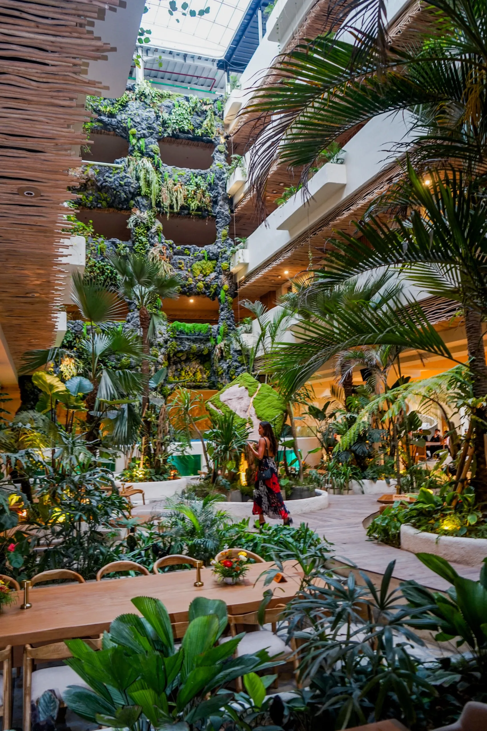 Restaurant seating surrounded by tropical greenery