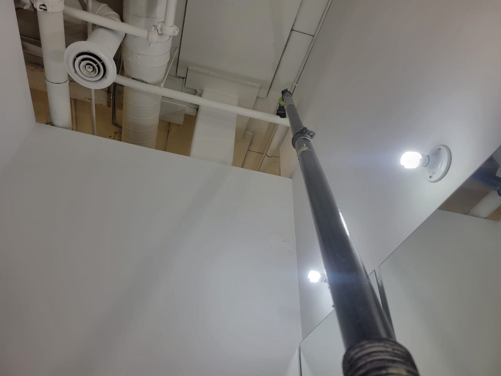 High-level dust removal equipment in use, condo stairwell, GTA