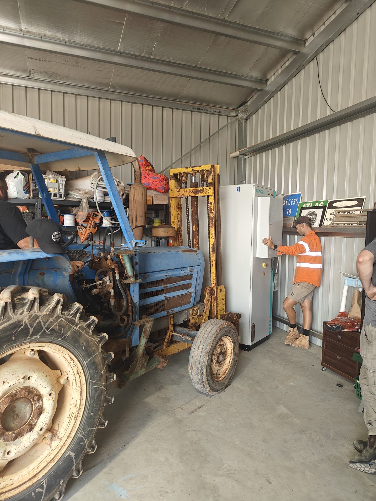 Ampaura VAST cabinet moved into a farm shed with a tractor forklift at Mildura